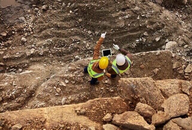 Construction Workers Inspecting Site