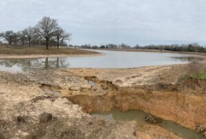 An Image from Cardinal Strategies of a dam breach water flooding.