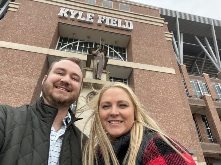 John and Kim from Cardinal Strategies in front of the Kyle Field Stadium.