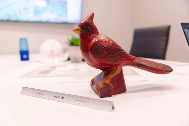 Red Cardinal bird statue on table