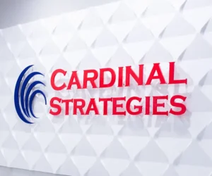 Home. Cardinal Strategies color logo sign in Conference room