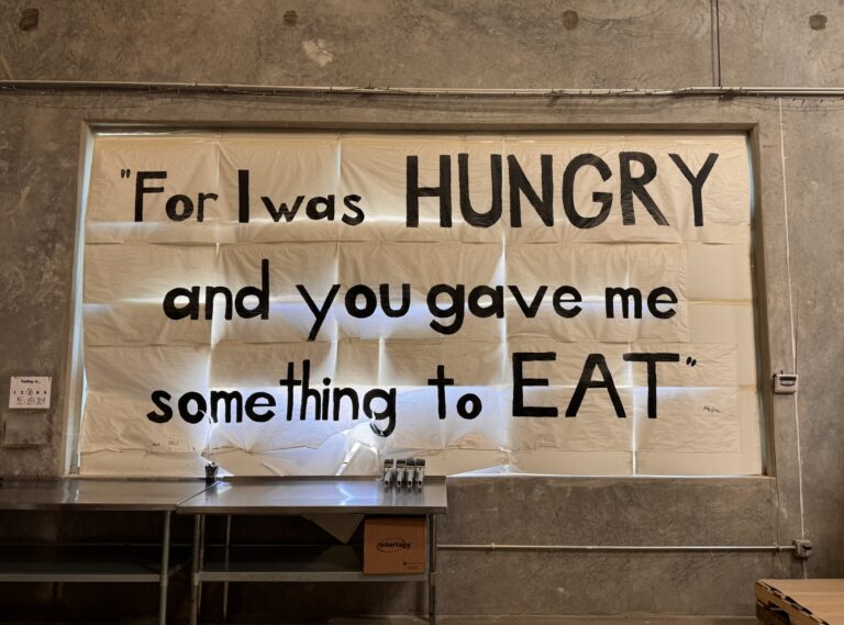 For I was hungry, and you gave me something to eat sign in window.