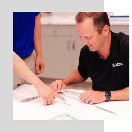 Thomas Caffarel looking over engineering plans