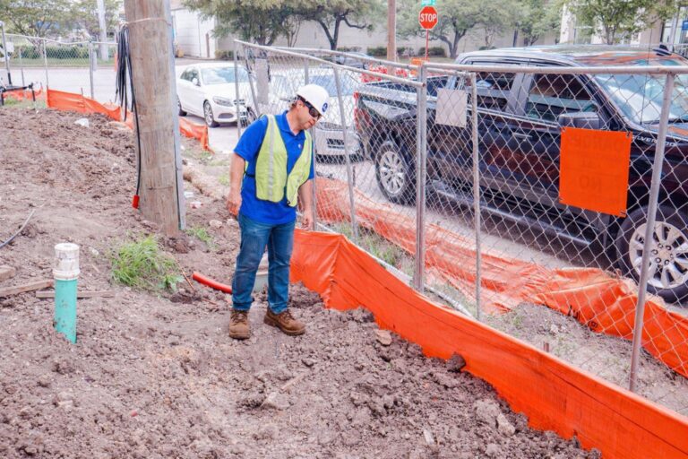 Stormwater Inspector looking at silt fence